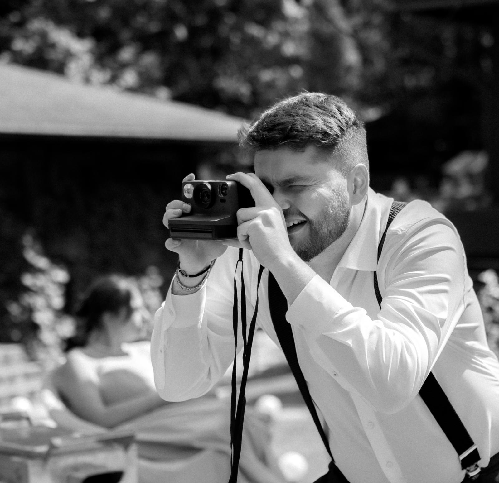 Photographer shooting an instant camera